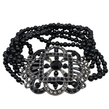 Afbeelding in Gallery-weergave laden, Bracelet manchette d'inspiration Art déco serti de strass noirs et blancs, années 1980