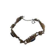 Load image into Gallery viewer, Bracelet en argent doré serti de cabochons en pâte de verre bleu, années 1880-1910