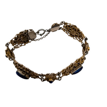 Load image into Gallery viewer, Bracelet en argent doré serti de cabochons en pâte de verre bleu, années 1880-1910