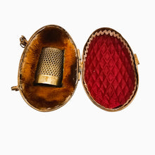 Load image into Gallery viewer, Porte-dé à coudre en forme d'œuf – Laiton ciselé – Écrin de couture, fin XIXe siècle Le Charme des Violettes - Brocante en ligne