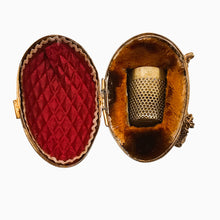 Load image into Gallery viewer, Porte-dé à coudre en forme d'œuf – Laiton ciselé – Écrin de couture, fin XIXe siècle Le Charme des Violettes - Brocante en ligne