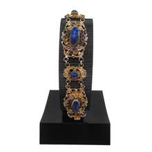 Load image into Gallery viewer, Bracelet en argent doré serti de cabochons en pâte de verre bleu, années 1880-1910
