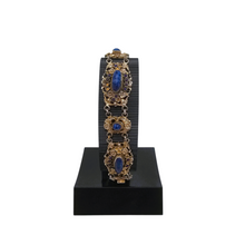 Load image into Gallery viewer, Bracelet en argent doré serti de cabochons en pâte de verre bleu, années 1880-1910
