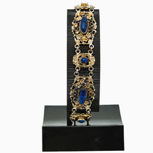 Load image into Gallery viewer, Bracelet en argent doré serti de cabochons en pâte de verre bleu, années 1880-1910 Le Charme des Violettes - Brocante en ligne
