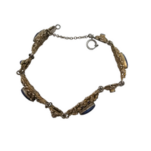 Load image into Gallery viewer, Bracelet en argent doré serti de cabochons en pâte de verre bleu, années 1880-1910
