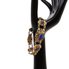 Load image into Gallery viewer, Bracelet en argent doré serti de cabochons en pâte de verre bleu, années 1880-1910
