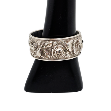 Bracelet à décor de roses, de marguerites et de lys en métal argenté, années 1940 Le Charme des Violettes - Brocante en ligne