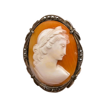 Load image into Gallery viewer, Shell cameo pendant brooch representing the God Apollo with laureate head, in an 800/1000 silver setting set with marcasites, early 20th century

