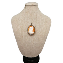 Load image into Gallery viewer, Shell cameo pendant brooch representing the God Apollo with laureate head, in an 800/1000 silver setting set with marcasites, early 20th century
