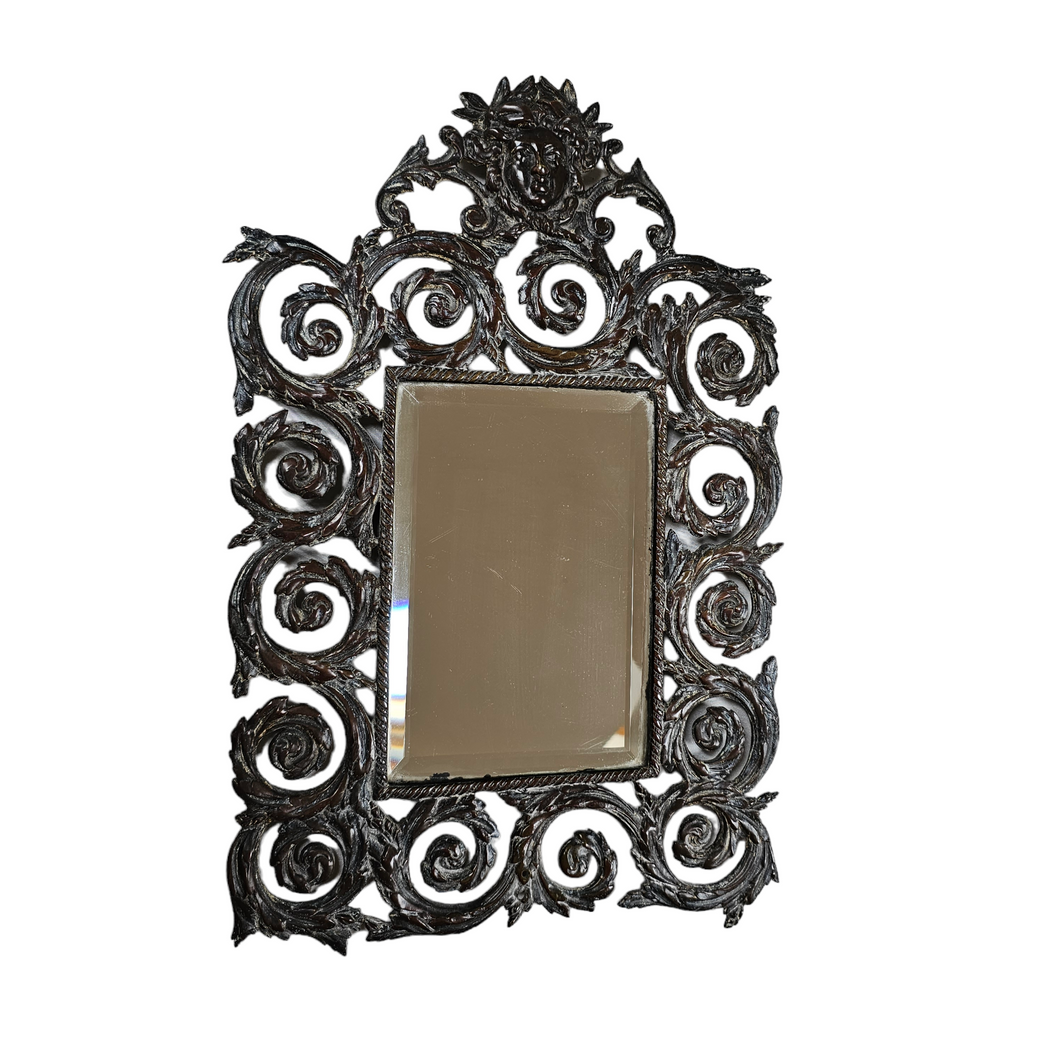 Bevelled mirror from the Napoleon III period in patinated bronze with openwork decoration in the style of Bérain