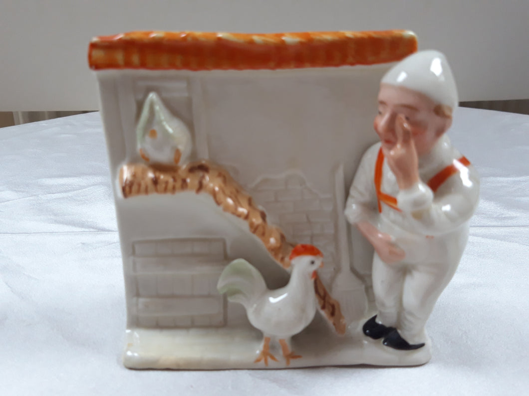 Old ceramic figurine: the farmer and his chicken coop