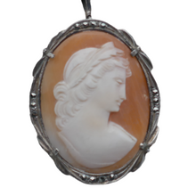 Load image into Gallery viewer, Shell cameo pendant brooch representing the God Apollo with laureate head, in an 800/1000 silver setting set with marcasites, early 20th century
